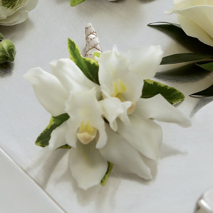 White Mini Cymbidium Boutonniere –  Buds N Bows, North Little Rock AR